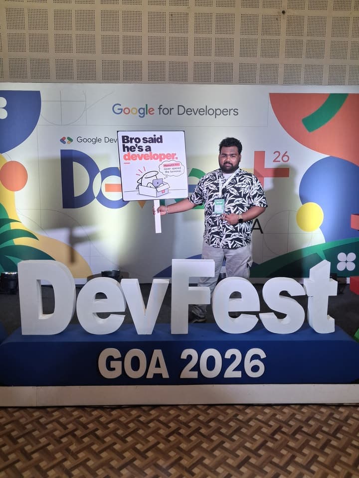 Shubham Chawhan holding a "Bro said he’s a developer" sign in front of a DevFest Goa 2026 banner reading Google for Developers.